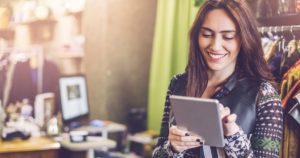Small business owner checking information on a tablet