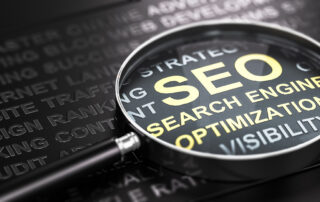 Magnifying glass and many words over black background, with the text SEO (Search Engine Optimization) written with golden letters. Internet marketing and SEO concept